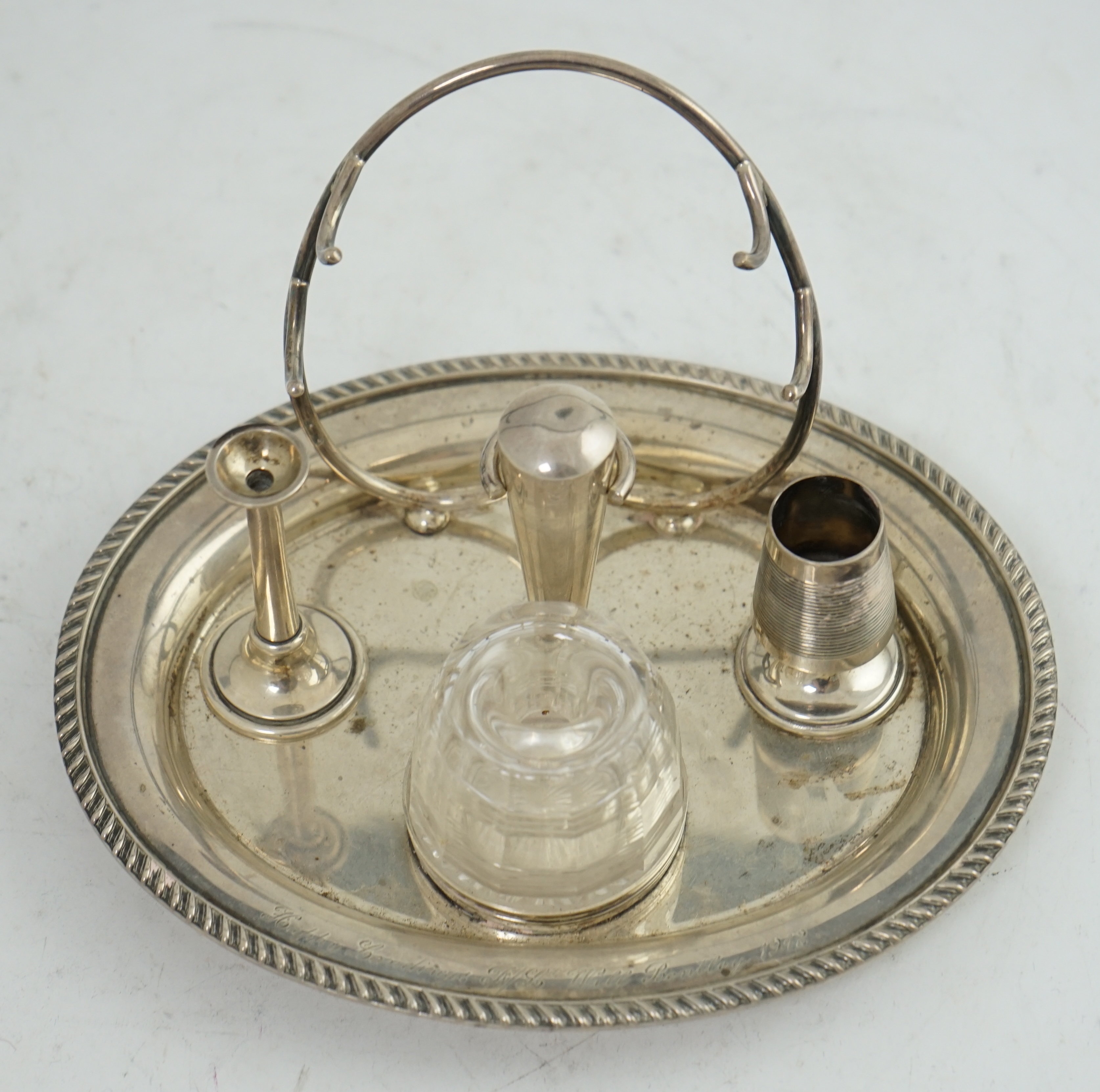 A late Victorian oval silver inkstand, with later RAF presentation inscription, maker Hukin & Heath